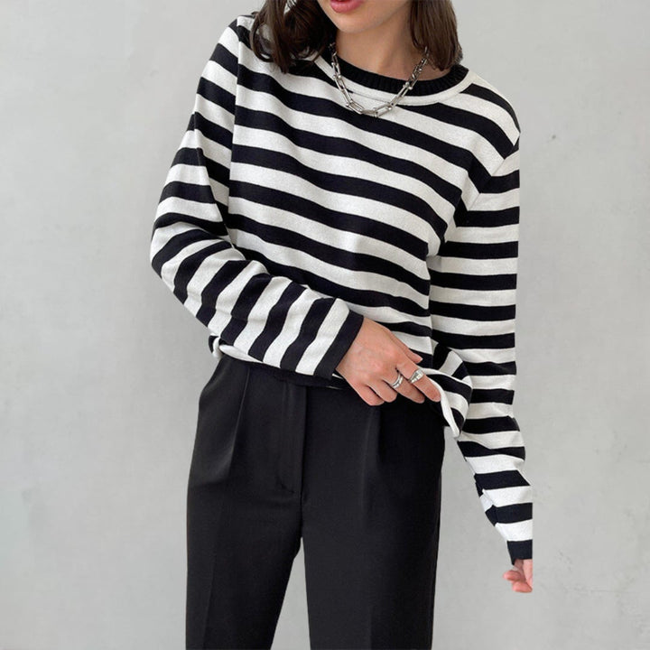 Dana striped T-shirt styled with denim jeans and sneakers for an easy everyday outfit