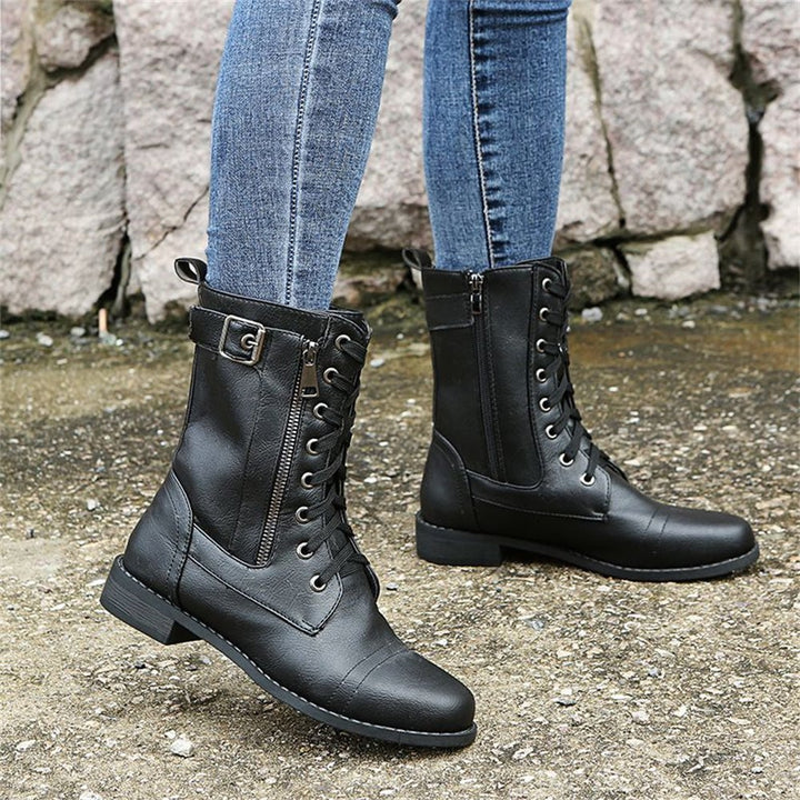 Detail shot of smooth side zipper on black orthopedic boot