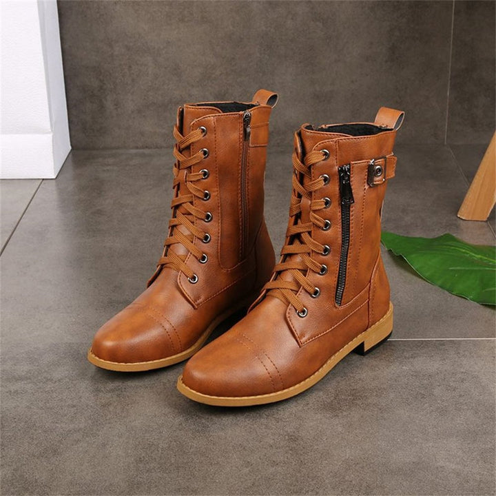 Angled view of gray orthopedic boot showing side zip and stable low heel