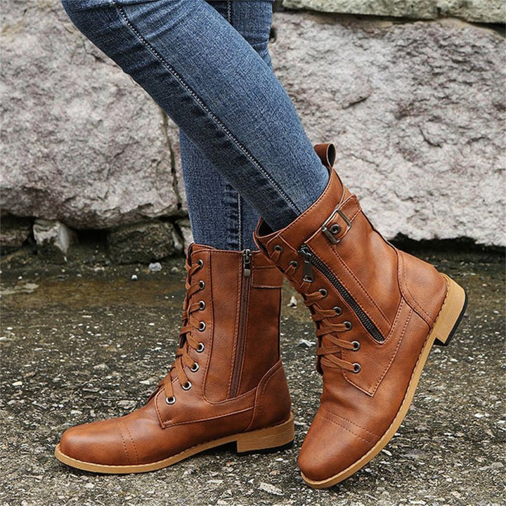 Flat lay of all three colorways of toe side zipper orthopedic boots on a white background