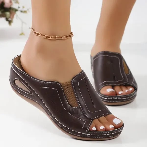 Close-up of Daphne sandal adjustable strap detail in brown