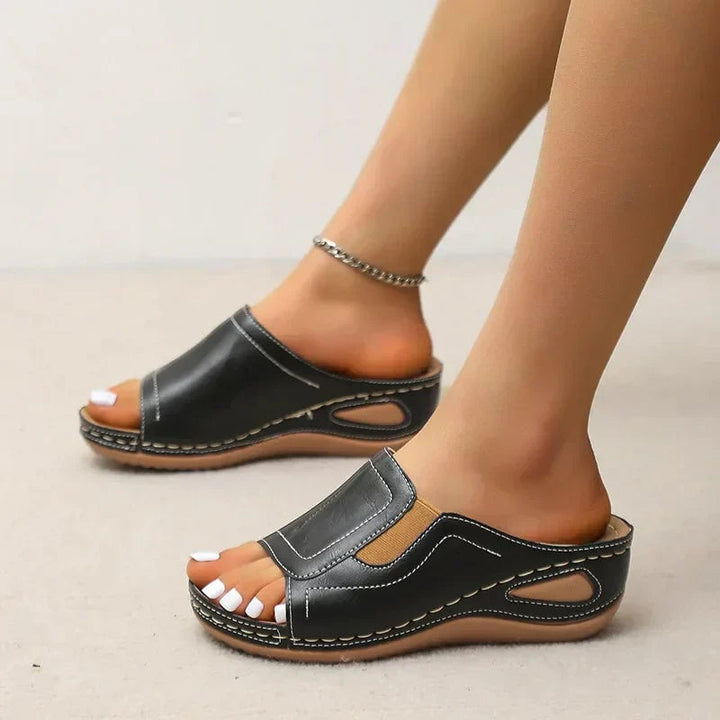 Pair of Daphne women's orthopedic sandals in brown and black color options side by side