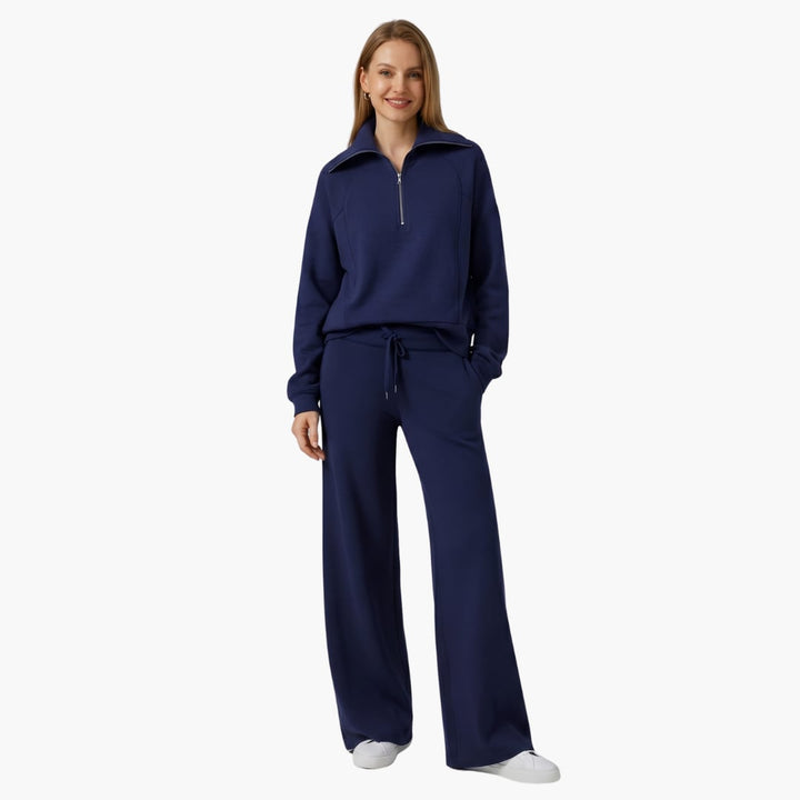 Women's half zip wide leg lounge set in navy styled with sneakers