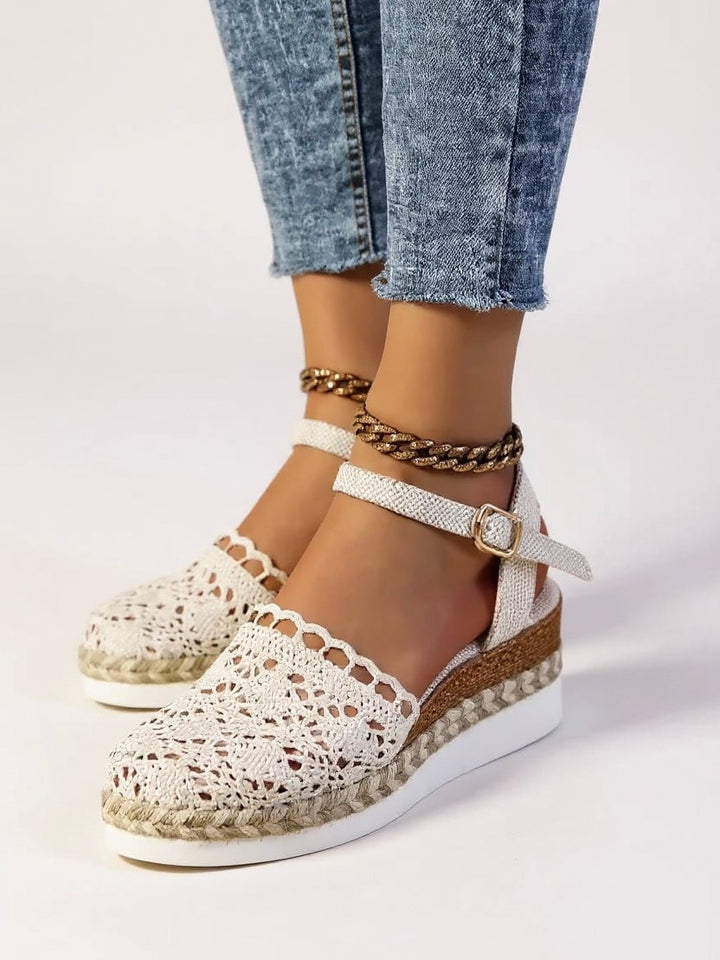 Darby platform sandals in brown worn on model, paired with casual denim