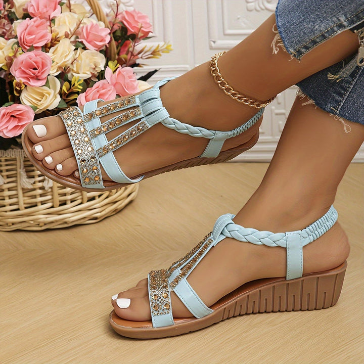 Flat lay of multiple Darby rhinestone woven sandal color options including red beige green and rose gold