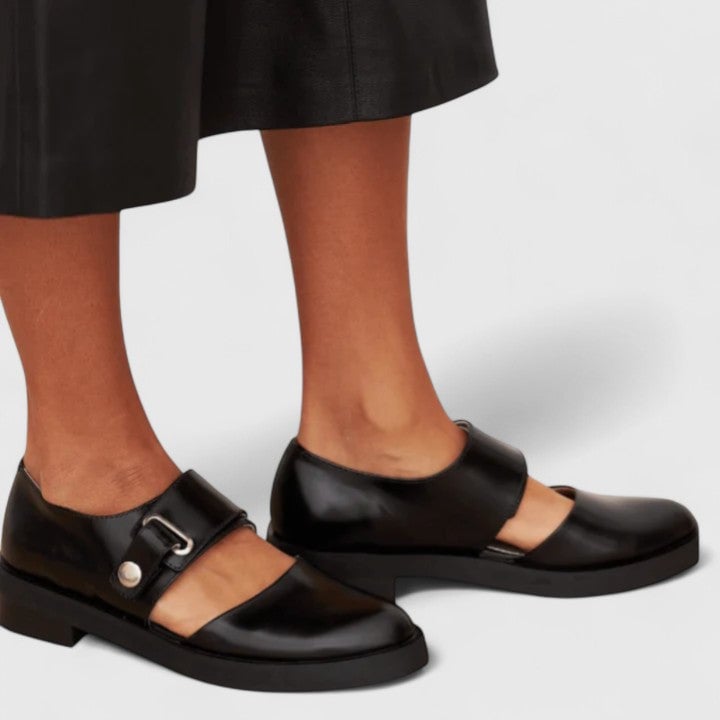 Side profile of the Darcy black elegant shoe showing streamlined design and cushioned construction