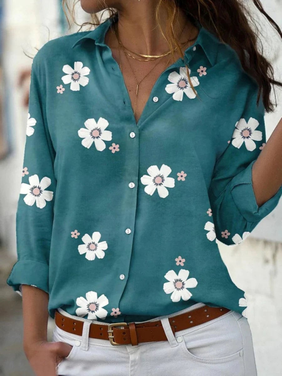 Floral print blouse displayed in multiple color options including pink, gray, blue, and green