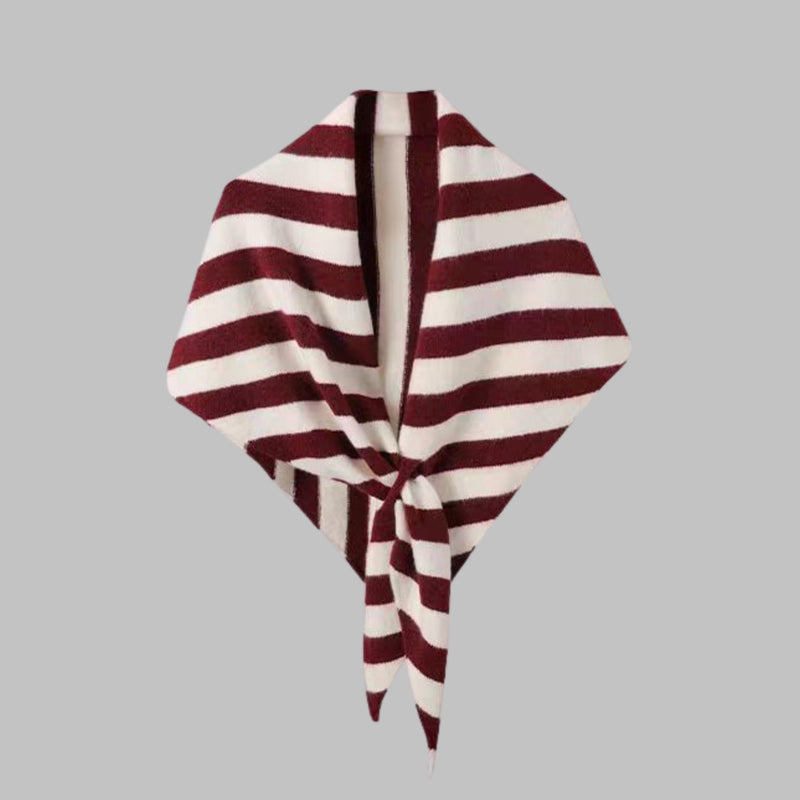 Woman wearing a red striped triangle shawl draped over her shoulders