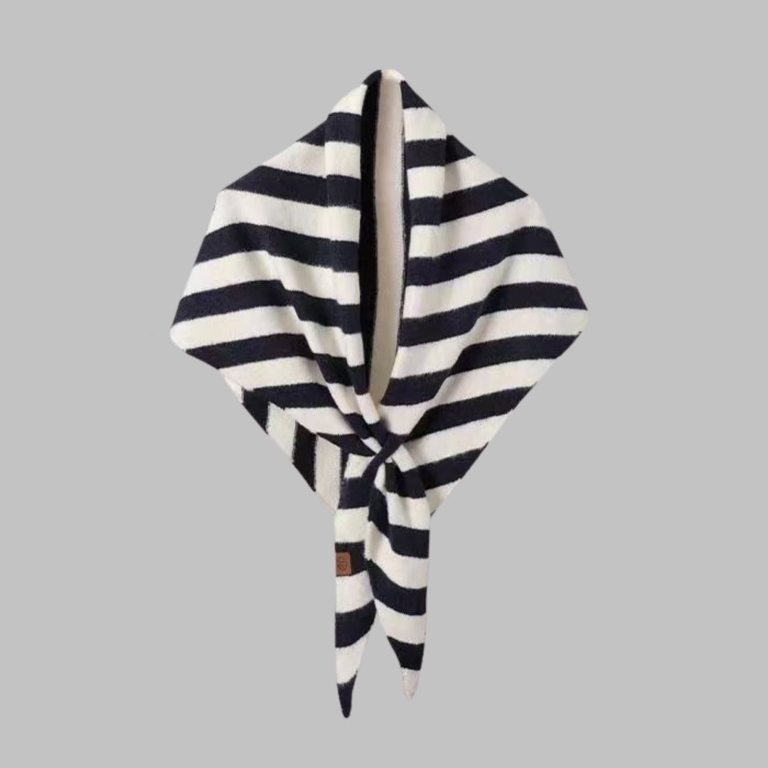 Black striped triangle shawl styled over a casual outfit