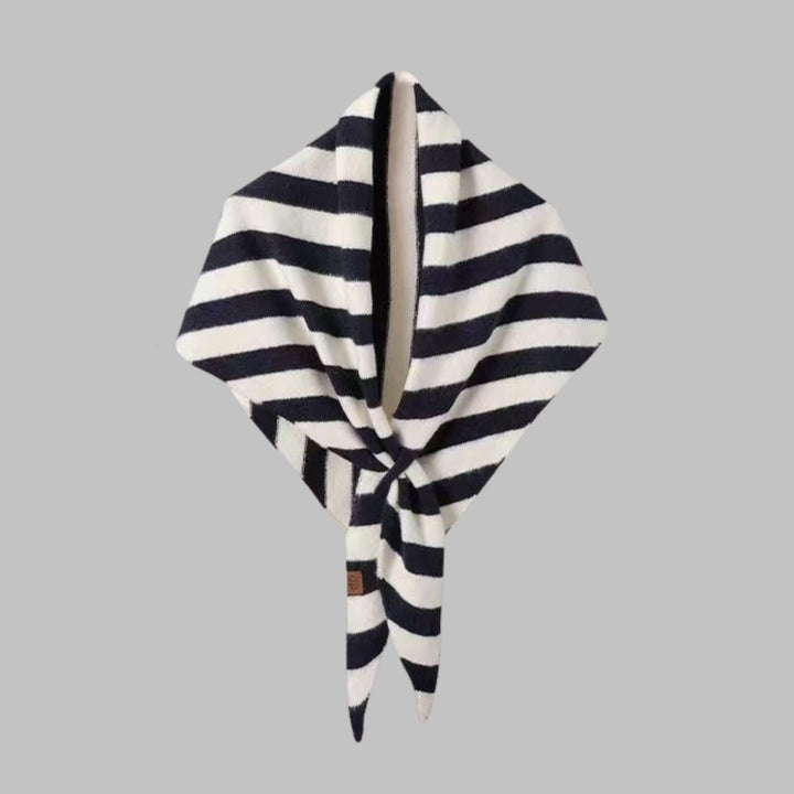 Black striped triangle shawl styled over a casual outfit