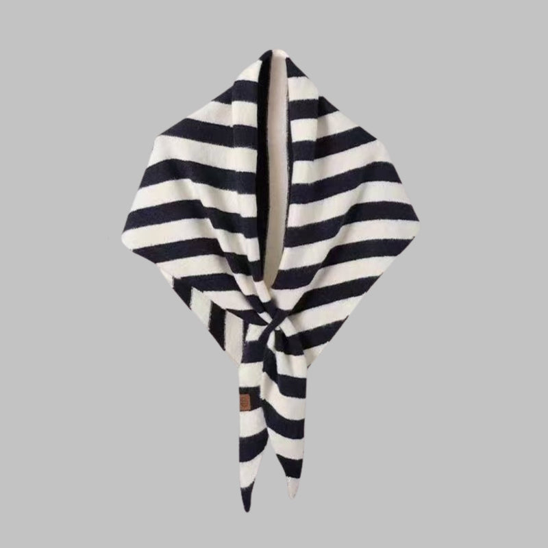 Black striped triangle shawl styled over a casual outfit