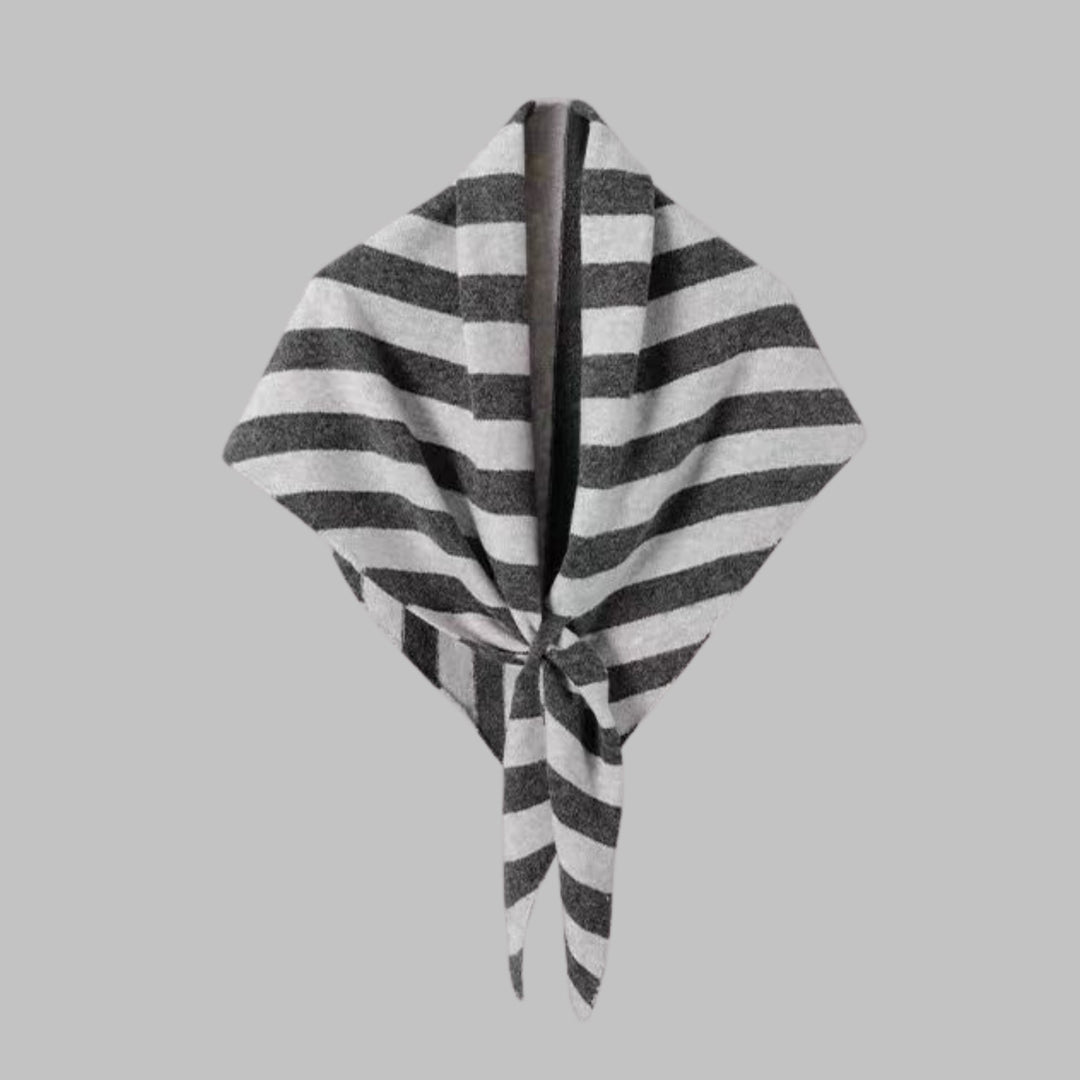 Navy striped triangle shawl worn loosely around the neck