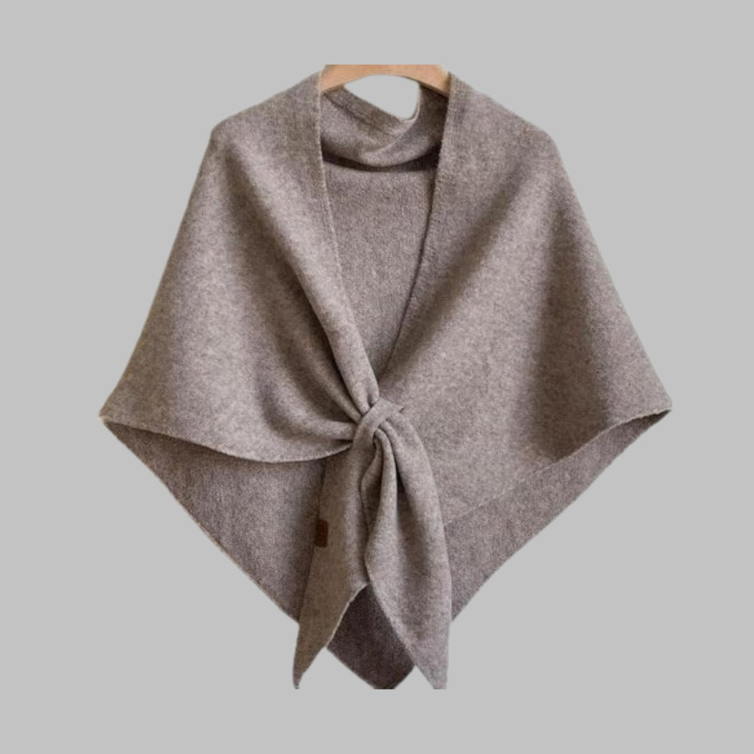 Dark gray triangle shawl knotted at the front on model