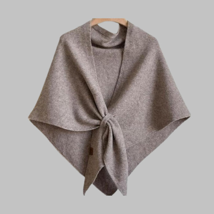 Dark gray triangle shawl knotted at the front on model