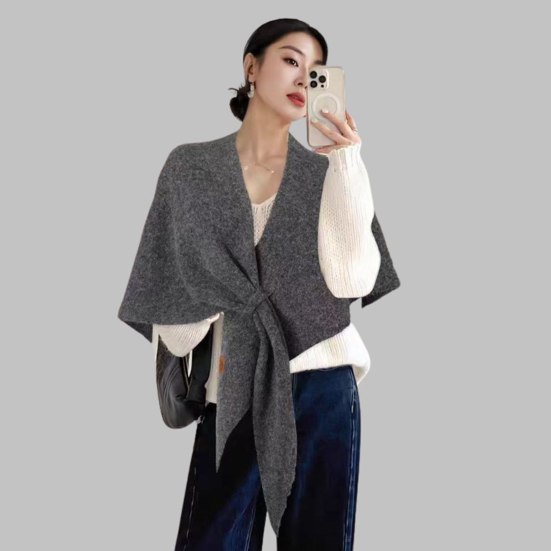 Model wearing solid triangle shawl in a casual daytime setting