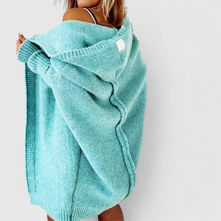 Flat lay of the oversized hooded knit cardigan showing size and color options