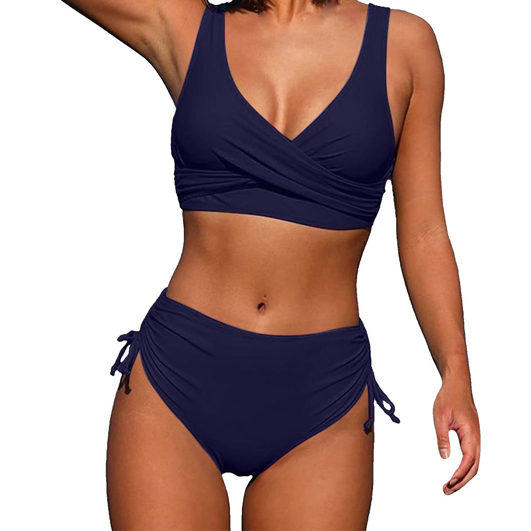 Model wearing green high-waisted bikini with wire-free adjustable top, front view
