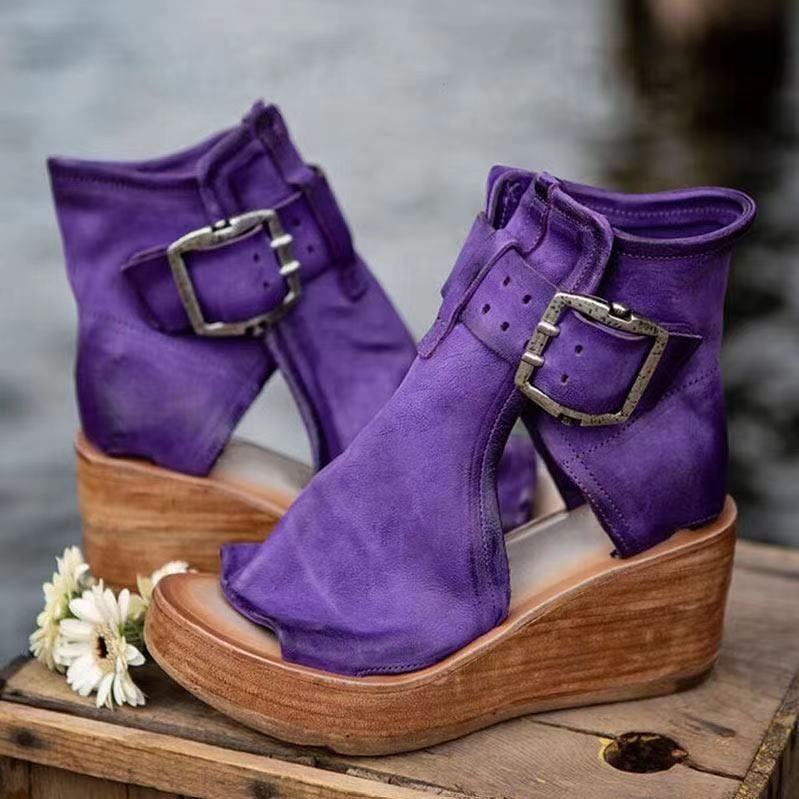Purple boho wedge sandals with buckle closure, side view on white background