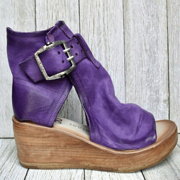 Buckle closure detail on brown boho wedge sandals