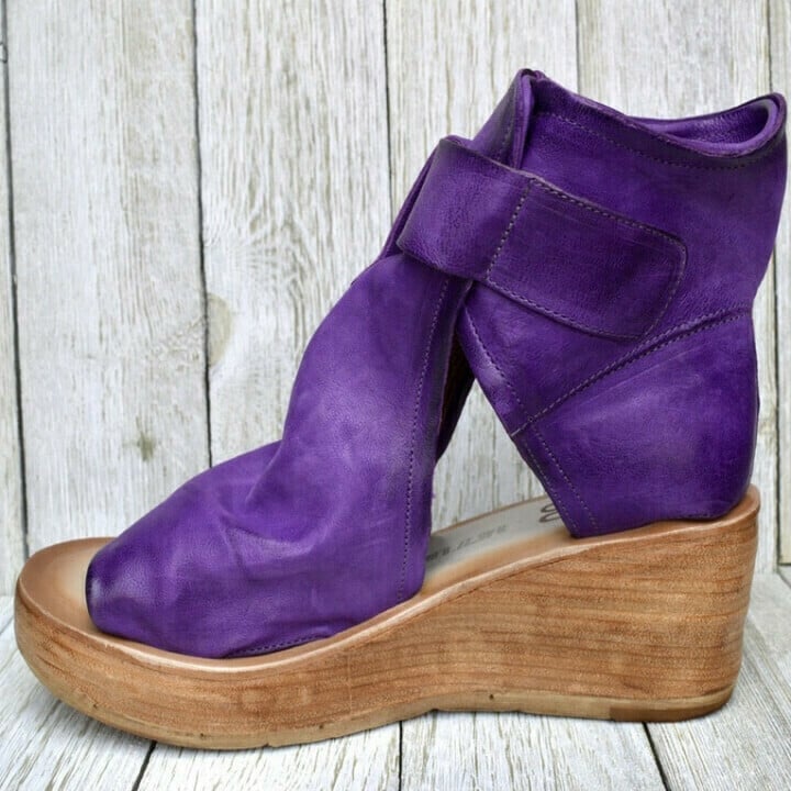 Model wearing purple boho wedge sandals with a flowy summer dress