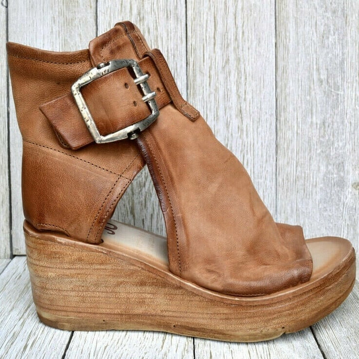 Flat lay of all four color options of boho wedge sandals on neutral background