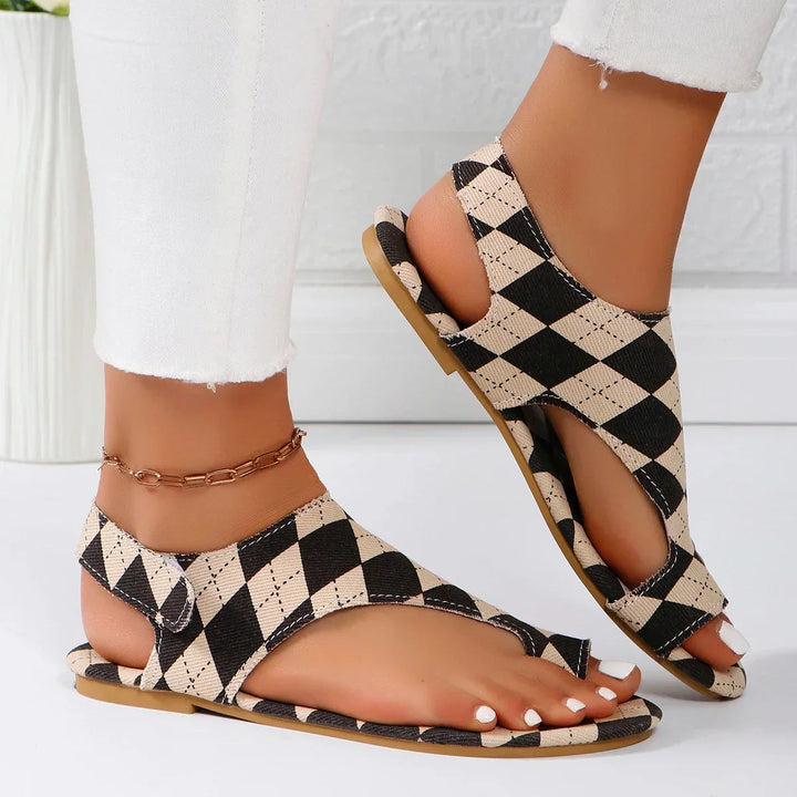 Dawn women's sandals in beige shown from the side, highlighting slim silhouette and secure straps