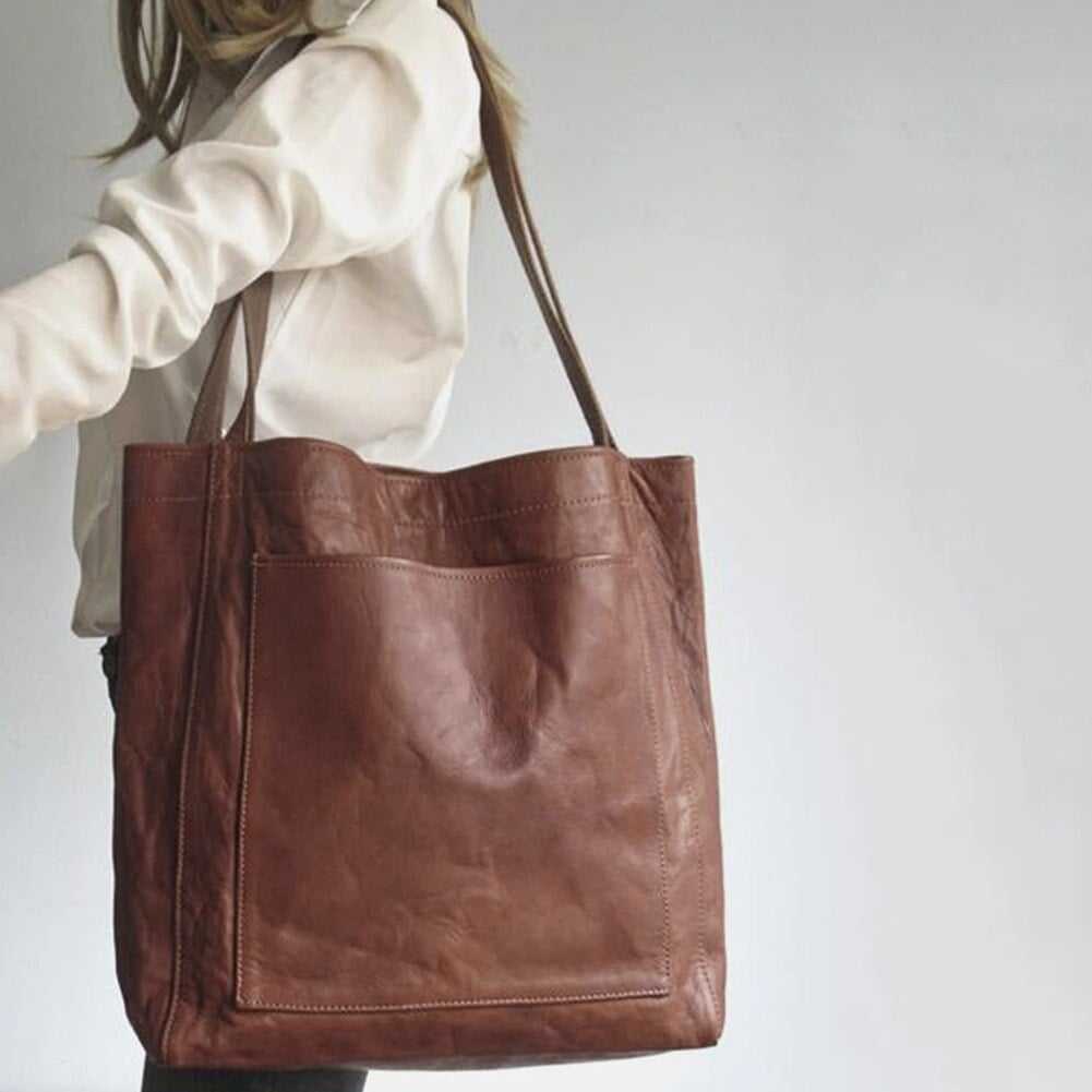 Interior view of the Debbie leather bag showing spacious compartments and pocket organization