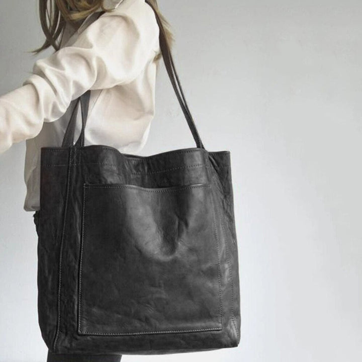 Debbie shoulder bag in brown showing the handle drop and base width dimensions