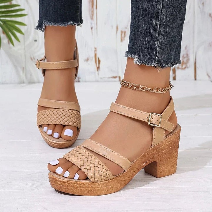 Khaki woven platform sandals with adjustable ankle strap on a neutral background