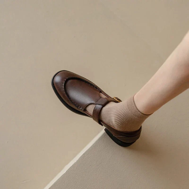 Delia brown Mary Jane shoes showing round toe box and clean stitched upper, side view