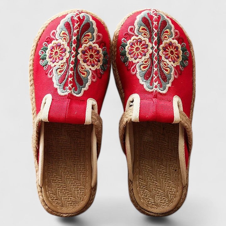 Delphina floral embroidered mules in red with hand-stitched bloom details, flat sole, slip-on backless silhouette