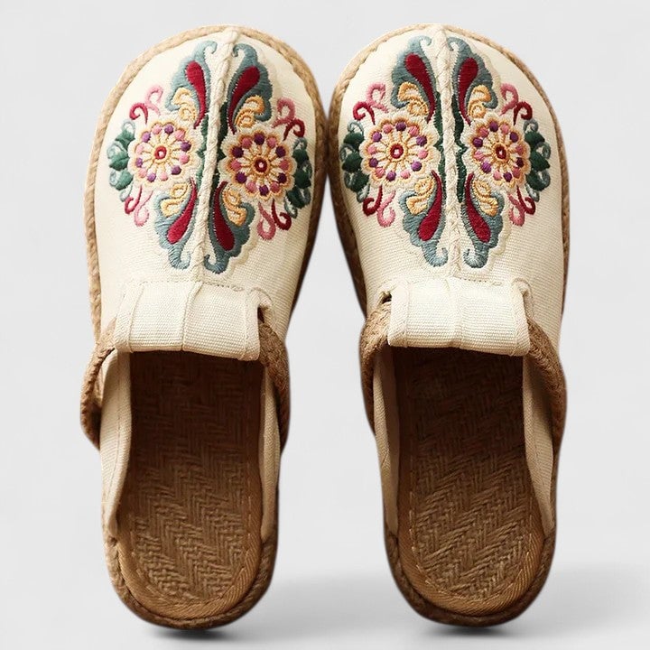 Side view of Delphina floral embroidered mules showing intricate embroidery and flat comfortable sole