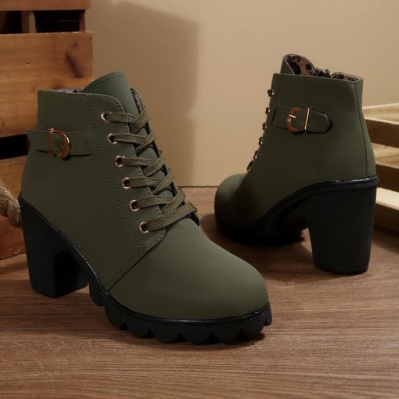 Close-up of chunky sole and lace-up front on women's ankle boots