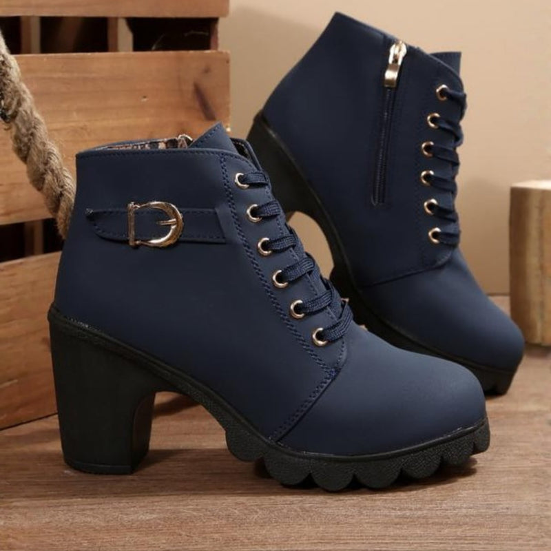 Women's chunky ankle boots styled with casual outfit, shown in army green colorway