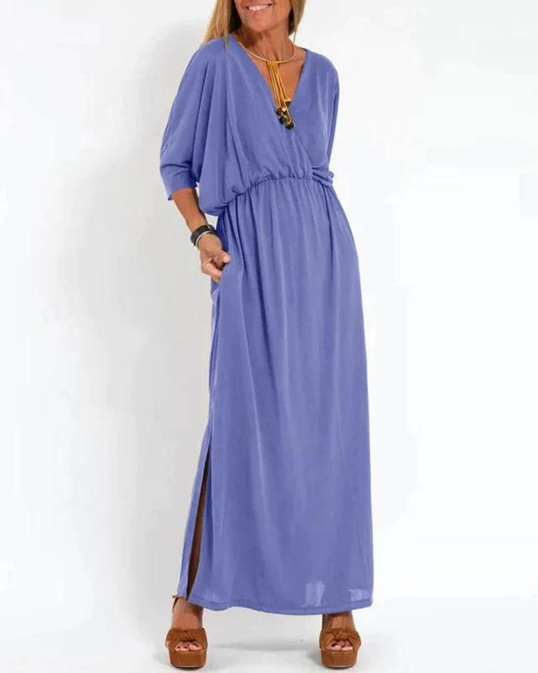 Side view of the Denise long maxi dress demonstrating its graceful length and airy fabric