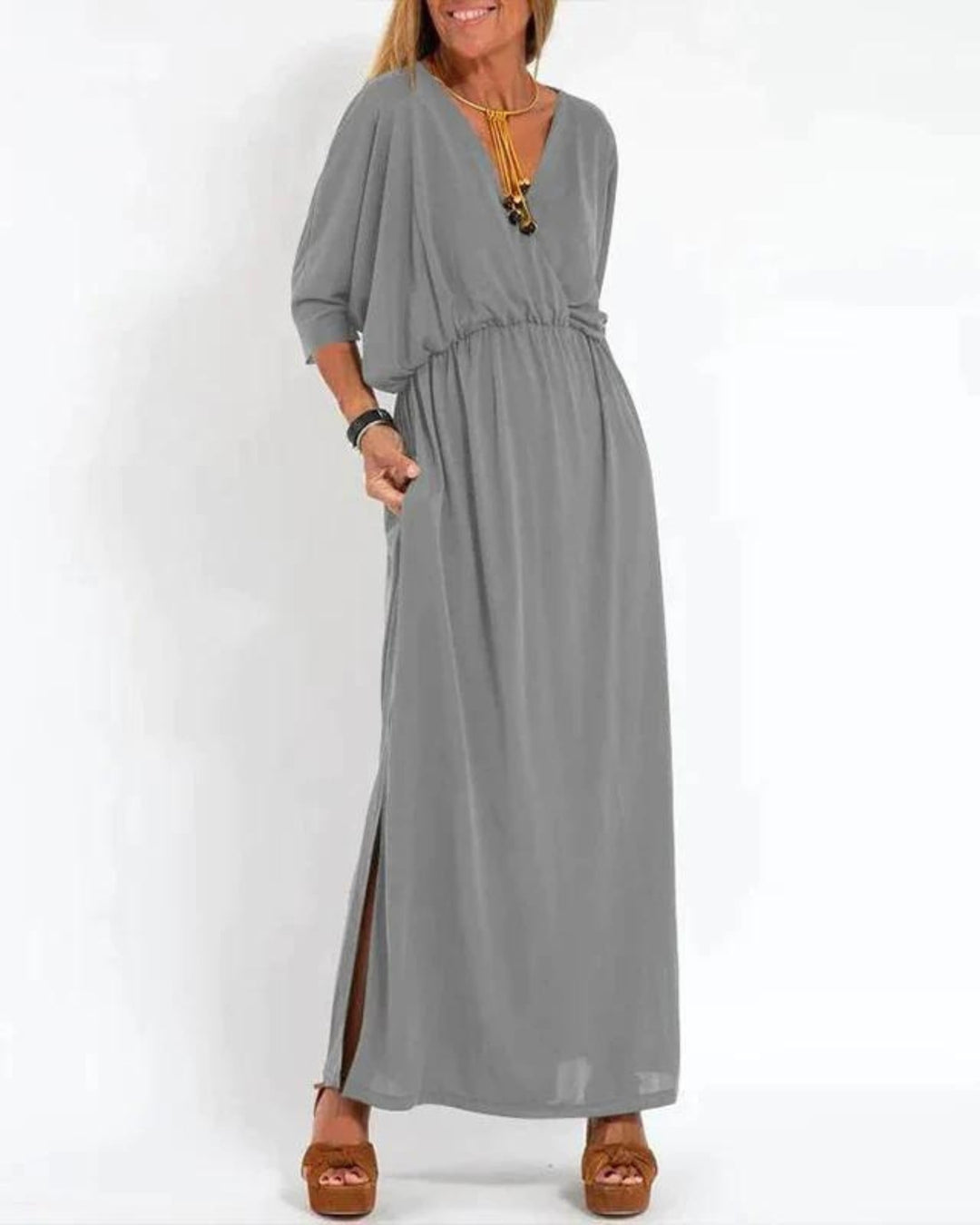 Detail shot of the Denise long maxi dress fabric texture and color options