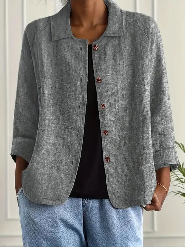Model wearing the lightweight layering top in light gray with a relaxed casual look