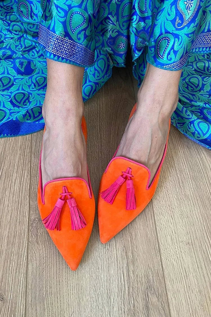 Close-up side view of Denise tassel loafers highlighting the structured silhouette and tassel detail