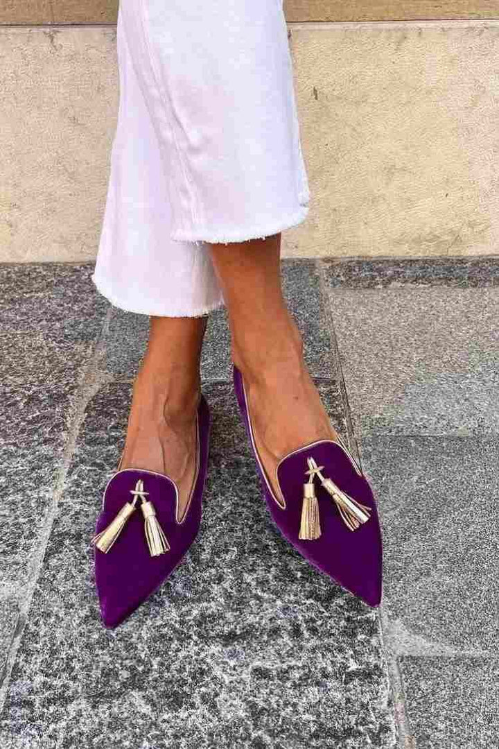 Top-down view of Denise tassel loafers showing the tassel trim and polished finish
