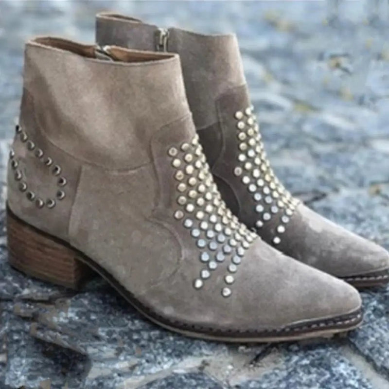 Gray studded boots styled with casual outfit, side profile view
