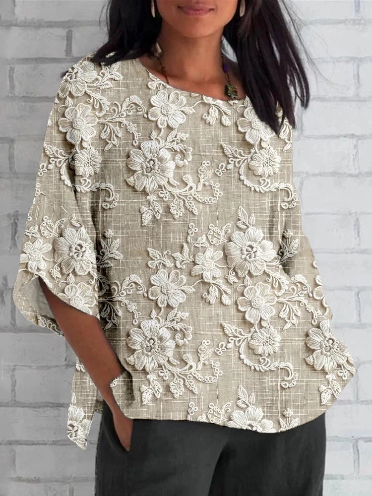 Model wearing a khaki vintage floral embroidered relaxed blouse with a soft, flowing silhouette