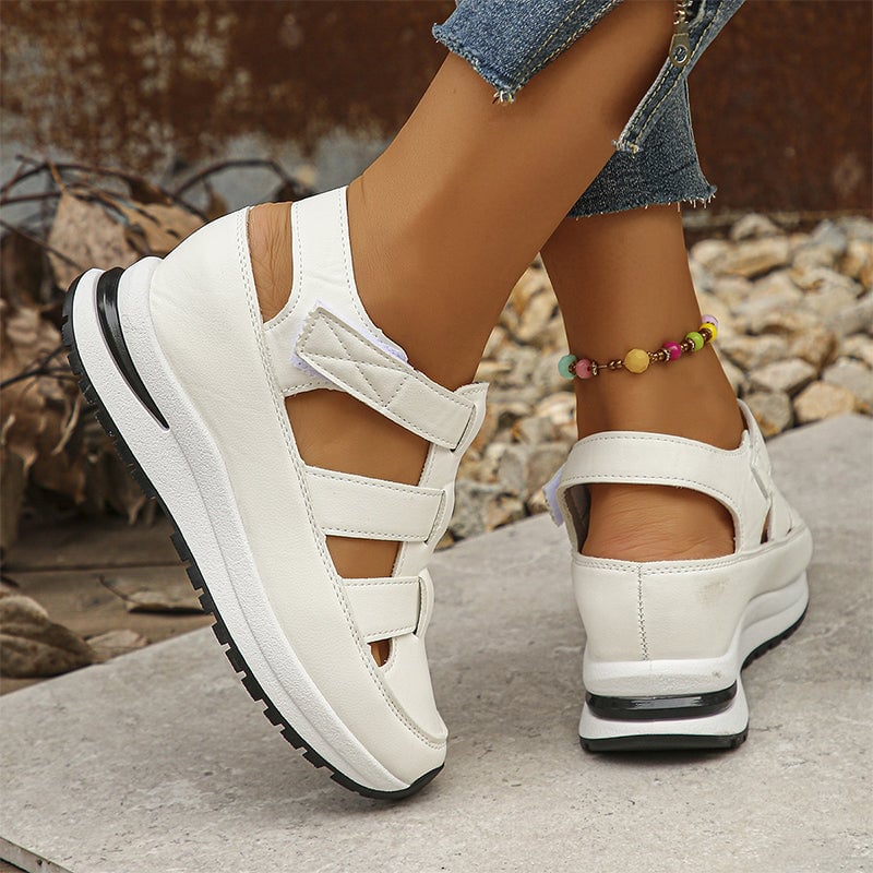Top-down view of Diane white sneakers showing adjustable strap and clean silhouette