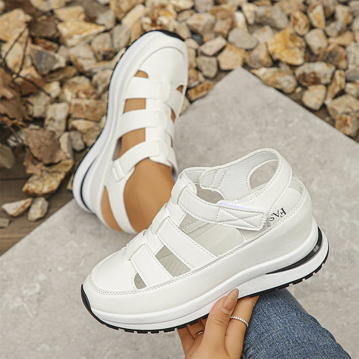 Diane sneakers in white and black colorways displayed side by side on neutral background
