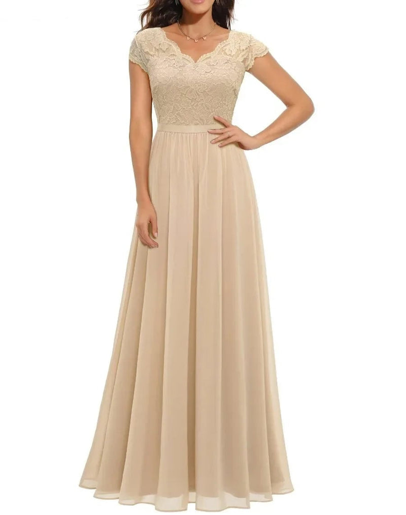 Front view of a women's lace maxi dress in champagne with delicate bodice detailing and graceful draped skirt