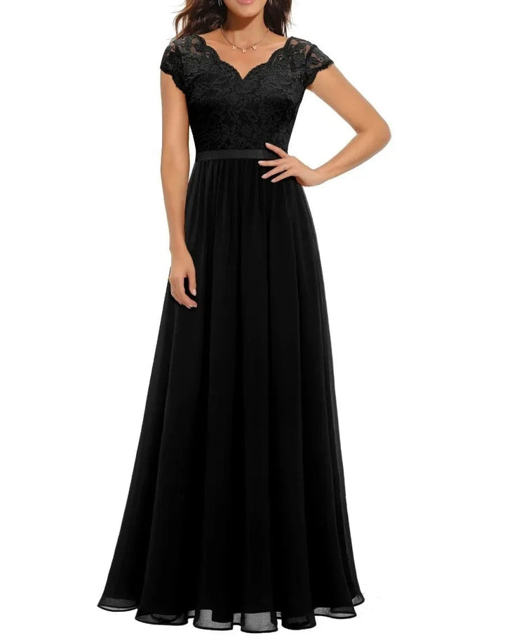 Back view of a women's elegant lace maxi dress in black, highlighting the draped fabric and lace panels