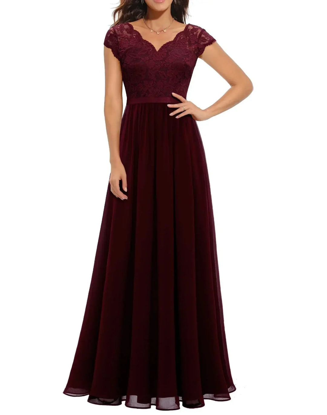 Side view of a women's elegant lace long dress in pink, highlighting the flowing draped skirt