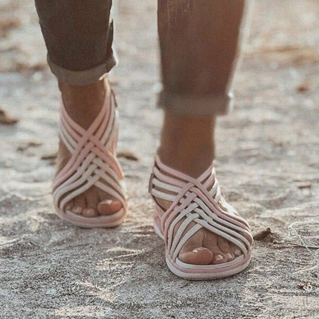 Woman walking outdoors in orthopedic spring sandals, showcasing flexible fit and everyday comfort
