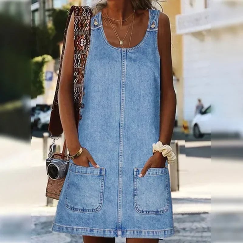 Front view of the Dolores blue sleeveless denim summer dress with functional side pockets