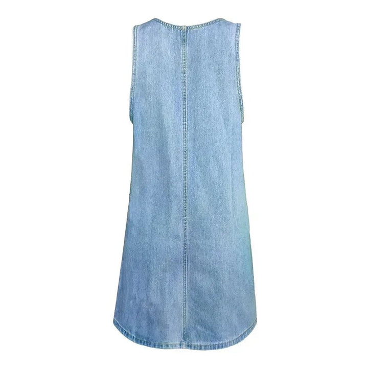 Side view of the Dolores sleeveless blue denim dress highlighting the relaxed A-line silhouette