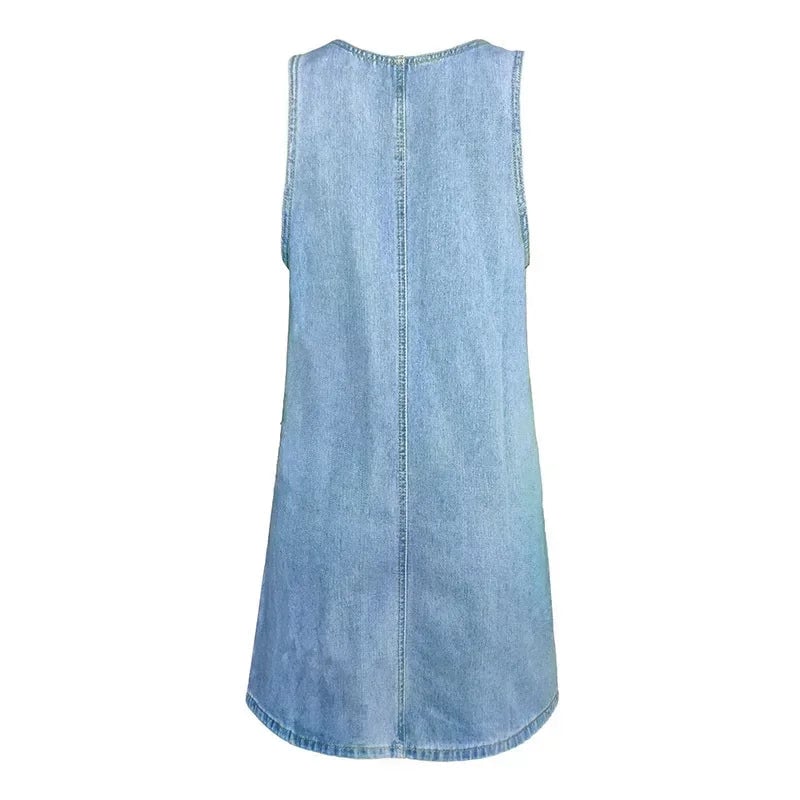 Side view of the Dolores sleeveless blue denim dress highlighting the relaxed A-line silhouette